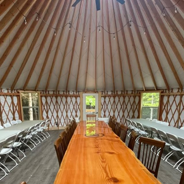 Event tent reception with floral centerpieces